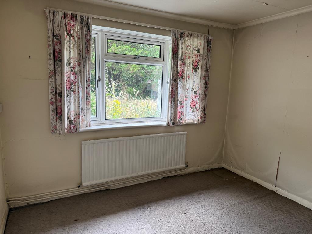 Lot: 159 - BUNGALOW WITH GARAGE AND GARDENS IN NEED OF MODERNISATION - bedroom 3 with window to rear